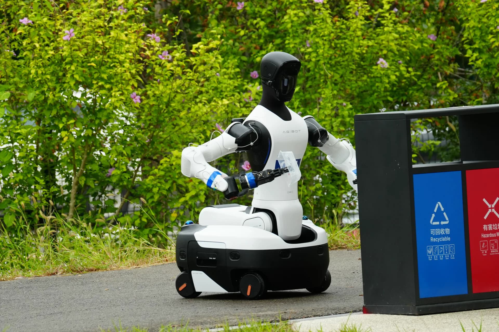 AGIBOT humanoid robot identifying the waste station on the park course